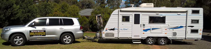 Morris Motors Land Cruiser hitched to a Caravan